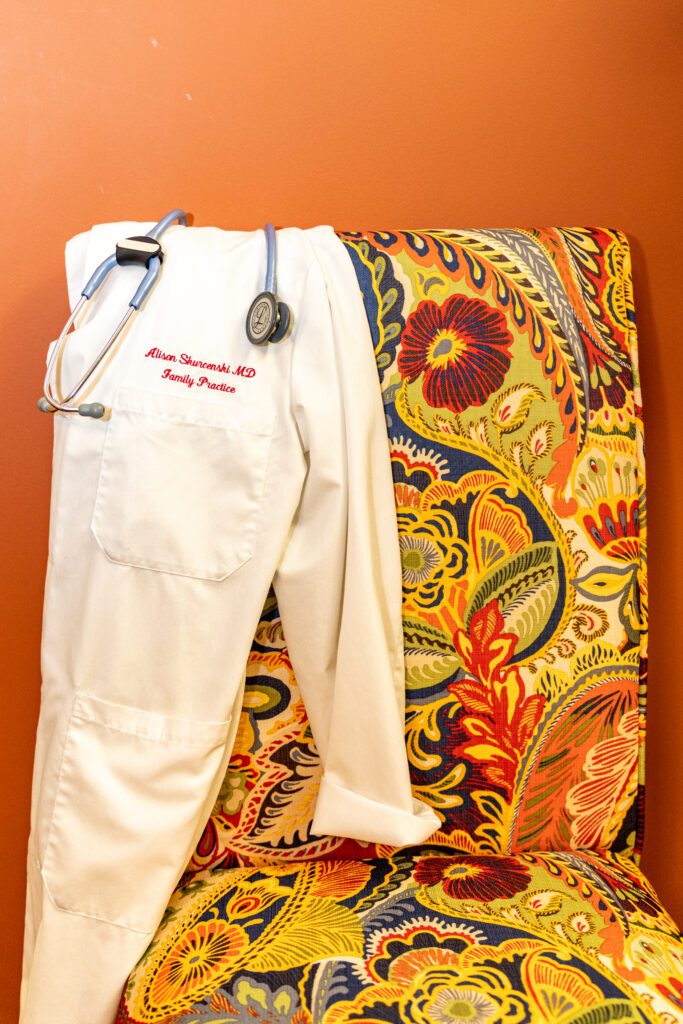 White doctor coat and stethoscope on chair